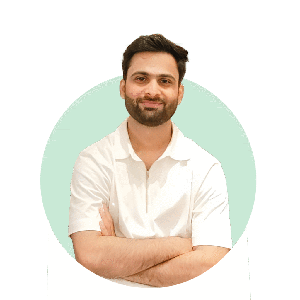 Director of Siddharth Finance standing confidently in a white shirt with arms crossed